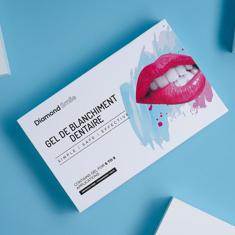 Diamond Smile Set de blanchiment des dents avec des seringues de gel de blanchiment des dents dans un emballage avec un fond bleu